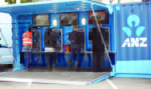 Fieldays visitors try out ANZ portable container bank.