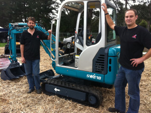 Territory manager for Endraulic Ltd, Allan Gudsell (left), and sales manager, Blair Sargison, with the same brand of digger that has been listed for one dollar on Trademe.