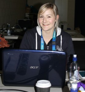 HARD AT WORK: Wintec journalism student Annie French, proudly clad in official RWC regalia, behind the scenes at the Wales-Fiji Rugby World Cup pool match on Sunday night.