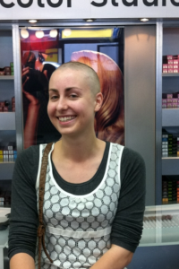 Close shave: Katie Levendis after shaving her blonde locks for famine victims
