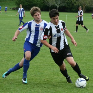 Andrew Clothier (in black and white), brushes off a tackle at the National Under 19s last year.