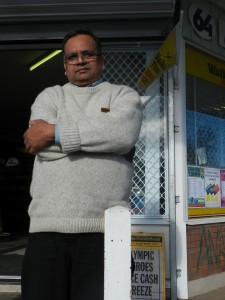 Jagdish Thakur hopes the barred windows and concrete bollards will be enough to protect his shop