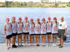 CHAMPION COACH: Baradene girls in the coxed under-15 eight, stand proudly with their Olympic-medalist coach Dudley Storey (right). Photo: Sharn Roberts