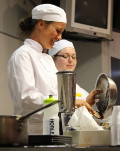 BETTER BATTER: Food blogger Emma Galloway demonstrating a biscuit recipe, helped by cookery student Kat Dooley.