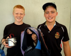 HANDOVER: Coxswain Jack Donaldson hands over his gear to Finley Deller, before the novelty race.