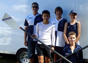 Teacher in charge of rowing at Tauranga Boys' College, Richard van Dijk, with young rowers Cameron Rose, Daniel Tomlinson, Dom Rogerson, and Ryan Dixon (kneeling). Photo: Libby Wilson