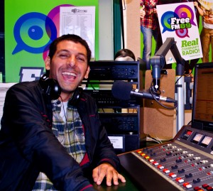 ON AIR: Juan Martinez prepares for his long show in the Free FM studio.