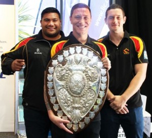 MEGA SHIELD: Waikato rugby players Teddy Tauroa, Decklan O'Dannall, and Rory Grice brought the Ranfurly Shield to Fieldays. Photo: Grace Hodge.