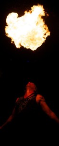 A fire dancer performs after the Earth Hour countdown.