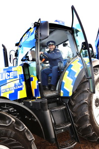 Michael Henwood with the tractor that bridges the gap between policemen and farmers. Photo: Kaycie O’Connor