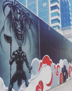 Te Haunui Tuna gave new life to an inner city wall with this powerful mural at the weekend. Photo: Heidi Gordon