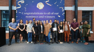A group photo of award winners and nominees.